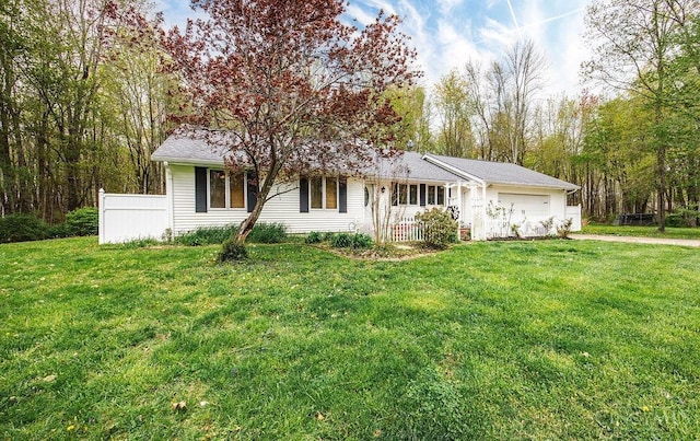 4092 Snowhill Rd, Perry Twp, OH 45118 - view of front of home featuring an attached garage, a front lawn, and driveway