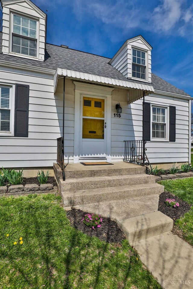 115 Maple Ave, Lebanon, OH 45036 - doorway to property with roof with shingles