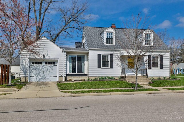 115 Maple Ave, Lebanon, OH 45036 - cape cod house with a chimney, a front lawn, driveway, a shingled roof, and a garage