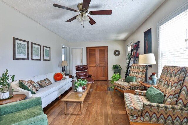 115 Maple Ave, Lebanon, OH 45036 - living room featuring wood-type flooring, a textured ceiling, a wealth of natural light, and ceiling fan