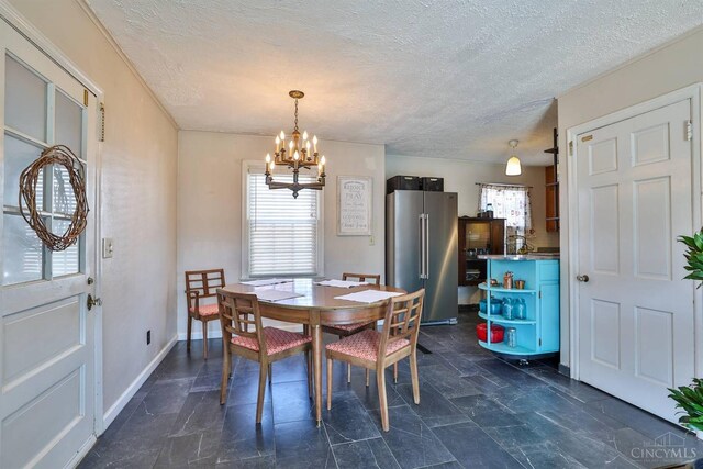 115 Maple Ave, Lebanon, OH 45036 - dining space featuring baseboards, a chandelier, and a textured ceiling