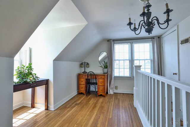115 Maple Ave, Lebanon, OH 45036 - interior space with baseboards, vaulted ceiling, visible vents, and hardwood / wood-style flooring