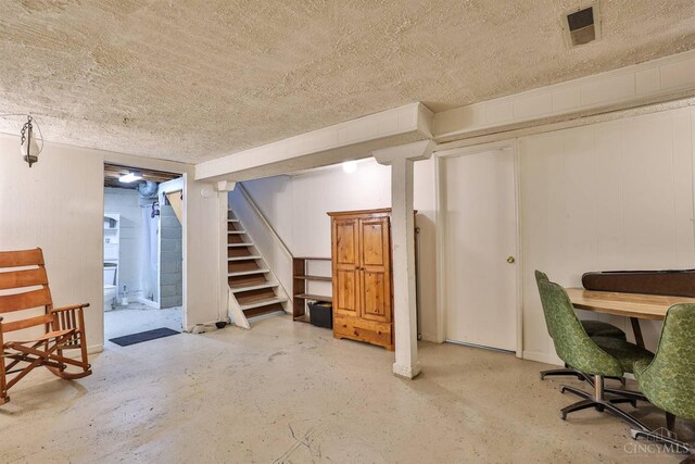 115 Maple Ave, Lebanon, OH 45036 - finished basement with stairs, a textured ceiling, and visible vents