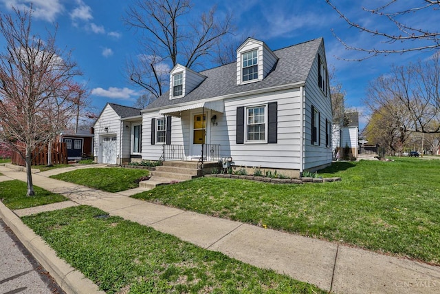 115 Maple Ave, Lebanon, OH 45036 - cape cod-style house with an attached garage, a shingled roof, and a front yard