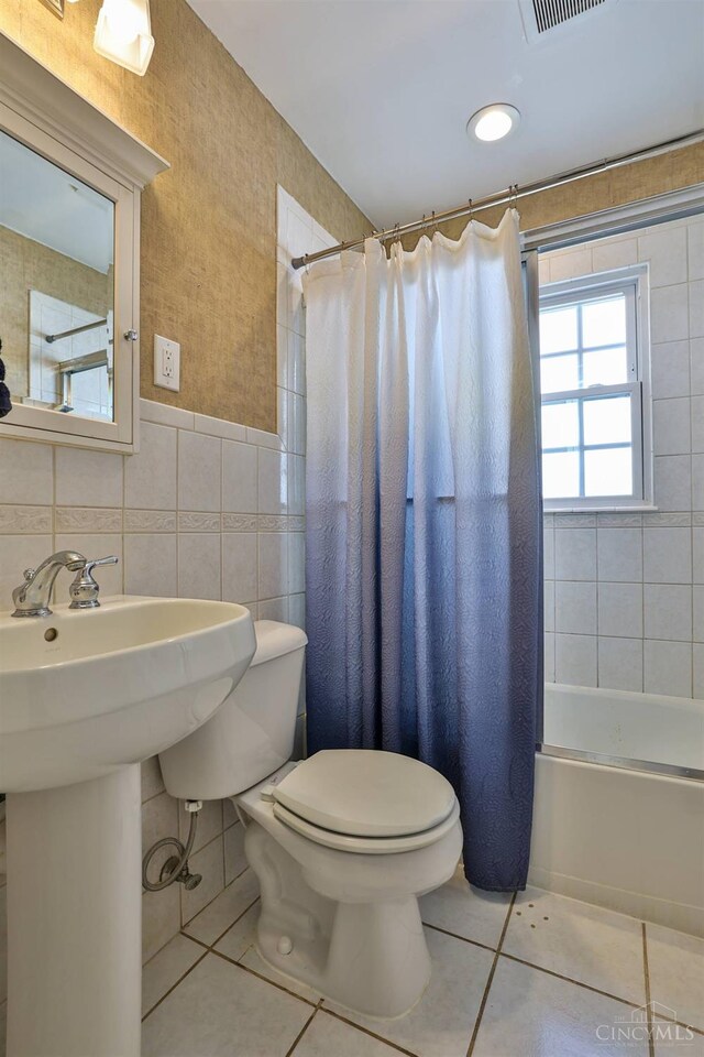 115 Maple Ave, Lebanon, OH 45036 - bathroom featuring tile patterned floors, shower / bath combo, toilet, tile walls, and visible vents