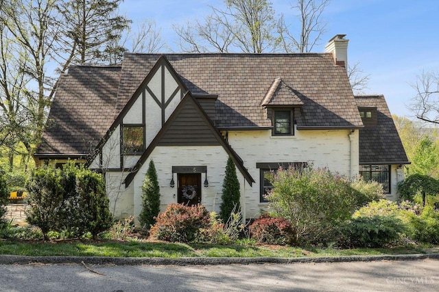 3725 Dogwood Ln, Columbia Twp, OH 45213 - view of front facade featuring a chimney and brick siding