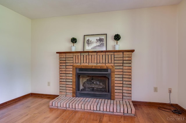 6139 N State Route 48, Clearcreek Twp, OH 45036 - detailed view of baseboards, wood finished floors, and a fireplace