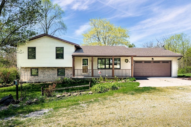 6139 N State Route 48, Clearcreek Twp, OH 45036 - tri-level home featuring covered porch, a garage, driveway, a front lawn, and roof with shingles