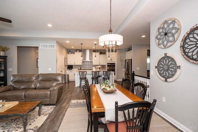 5038 Maiden Way, Liberty Twp, OH 45011 - dining area featuring wood finished floors, recessed lighting, a chandelier, and baseboards