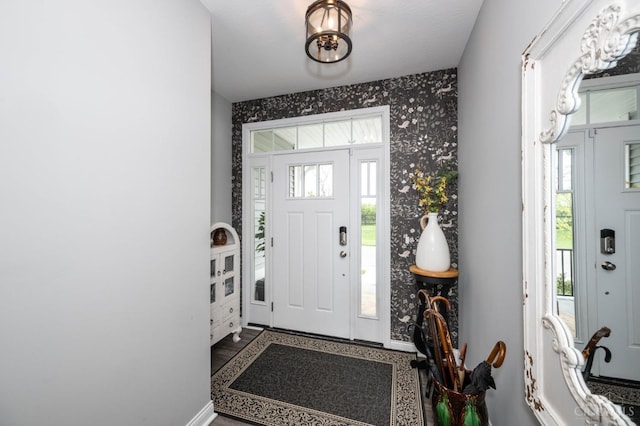 5038 Maiden Way, Liberty Twp, OH 45011 - foyer with plenty of natural light, wallpapered walls, and baseboards