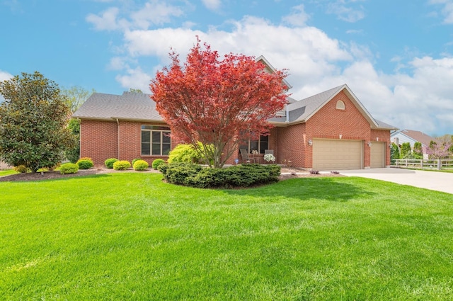 view of front of home featuring brick siding, an attached garage, fence, and a front yard