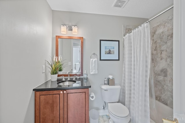 bathroom featuring vanity, shower / bath combo, toilet, and visible vents