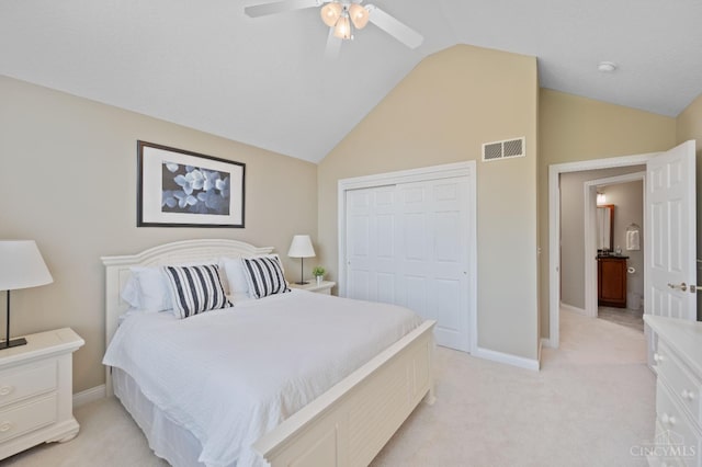 bedroom with visible vents, a closet, light carpet, baseboards, and ceiling fan