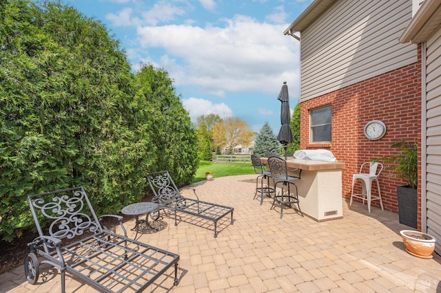 view of patio with outdoor dry bar