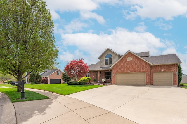 traditional-style house featuring a garage, a front yard, brick siding, a shingled roof, and driveway