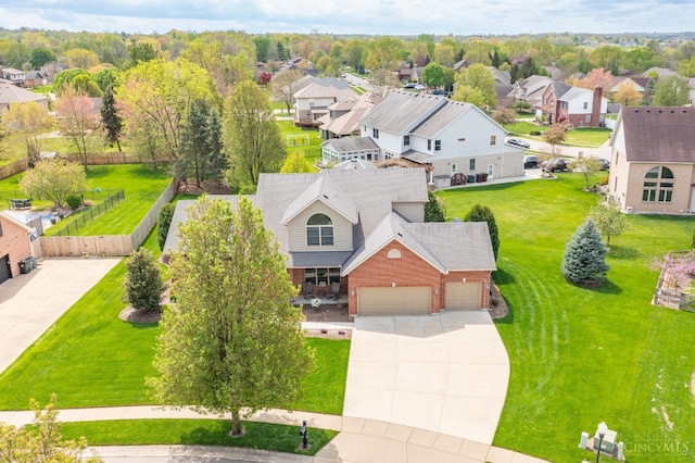 birds eye view of property with a residential view