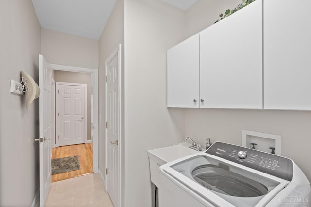 laundry area with washer / clothes dryer, baseboards, and cabinet space