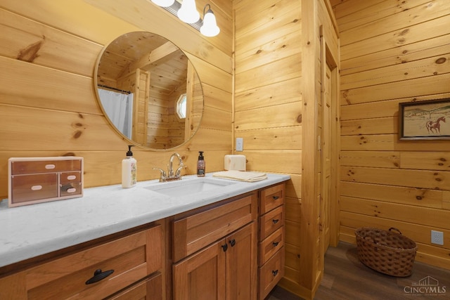 1607 Kato Ln, Marion Twp, OH 43155 - bathroom with wood walls, vanity, and wood finished floors