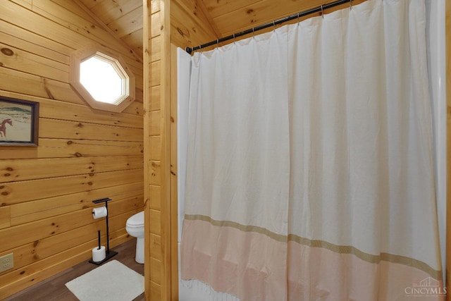 1607 Kato Ln, Marion Twp, OH 43155 - full bathroom with wood walls, toilet, wood finished floors, curtained shower, and lofted ceiling