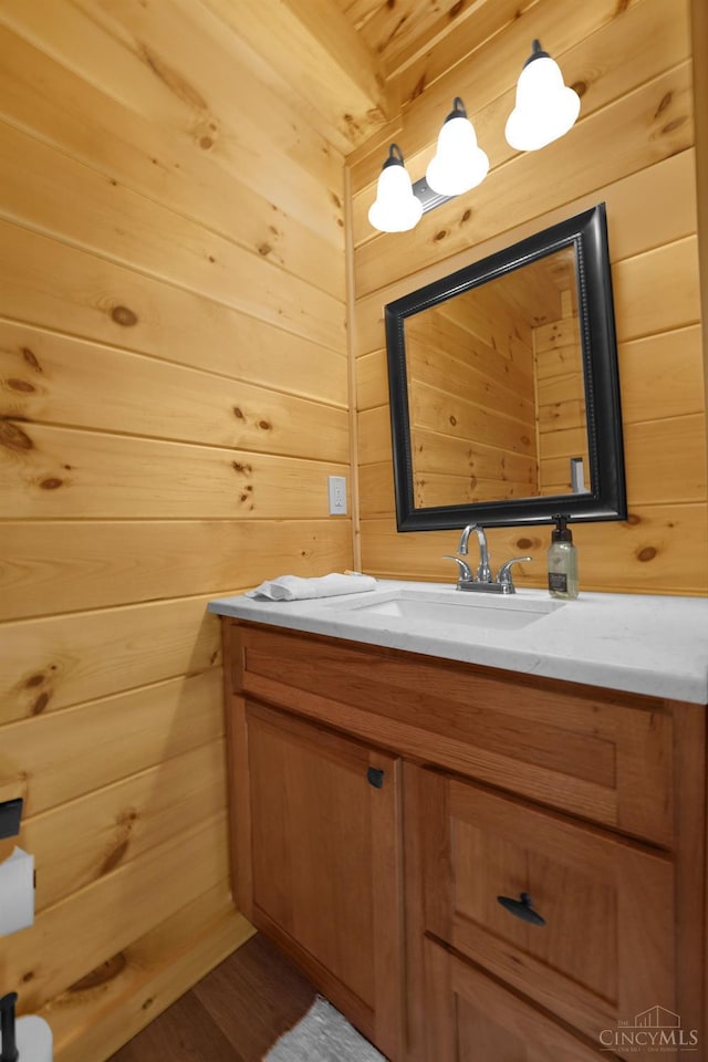 1607 Kato Ln, Marion Twp, OH 43155 - bathroom with wood walls, vanity, and wood finished floors
