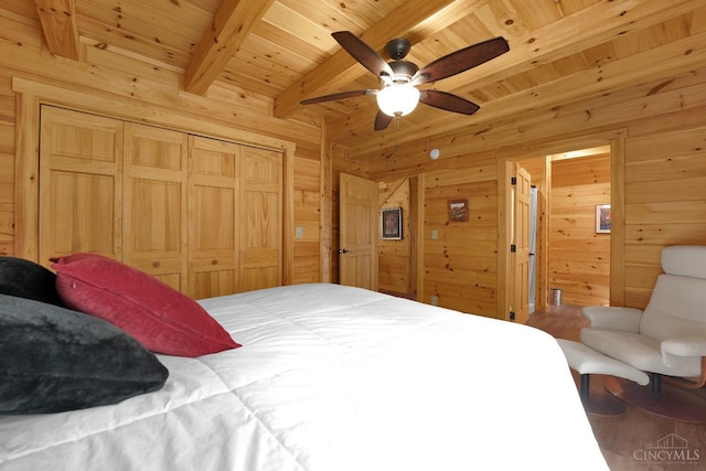 1607 Kato Ln, Marion Twp, OH 43155 - bedroom with wooden walls, beam ceiling, wood finished floors, wood ceiling, and a closet