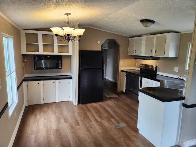 107 Elm St, Georgetown, OH 45121 - kitchen with black appliances, dark wood-style flooring, vaulted ceiling, white cabinets, and dark countertops