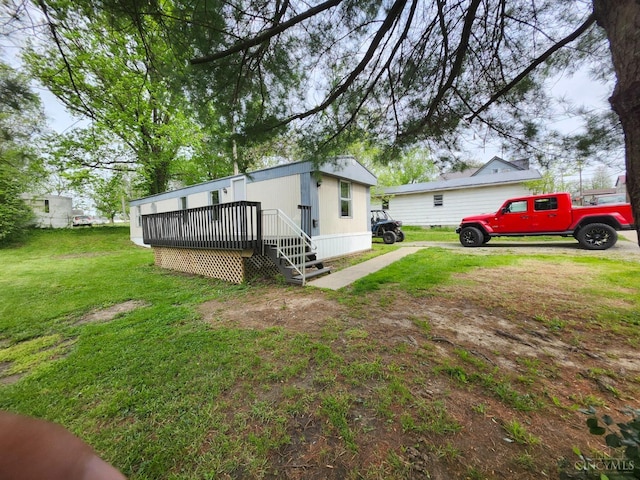 107 Elm St, Georgetown, OH 45121 - view of side of property featuring a lawn and a deck