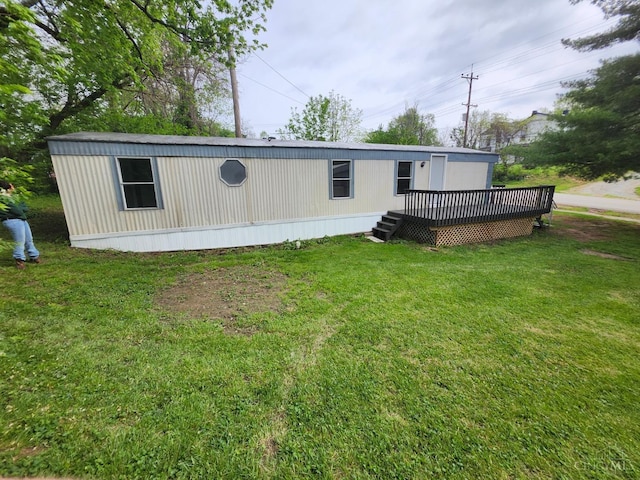 107 Elm St, Georgetown, OH 45121 - rear view of property featuring a wooden deck and a yard