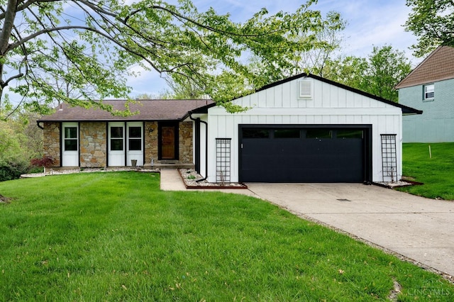 5172 Sheits Rd, Colerain Twp, OH 45251 - view of front facade with an attached garage, stone siding, board and batten siding, a front yard, and driveway