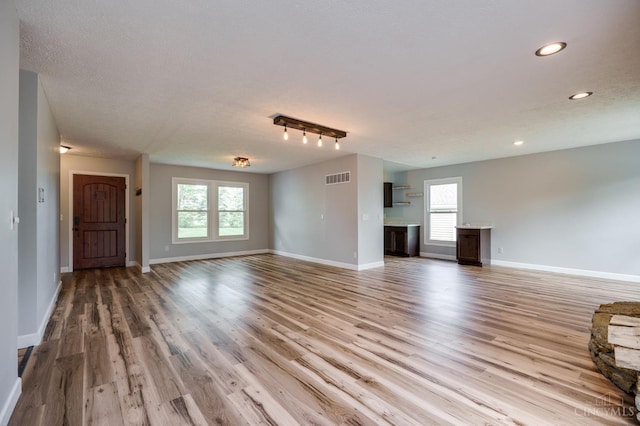 5172 Sheits Rd, Colerain Twp, OH 45251 - unfurnished living room featuring wood finished floors, recessed lighting, baseboards, and a textured ceiling