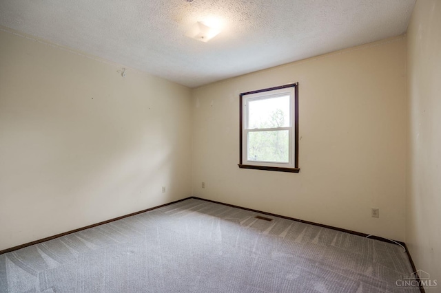 5172 Sheits Rd, Colerain Twp, OH 45251 - unfurnished room with light colored carpet, a textured ceiling, and baseboards