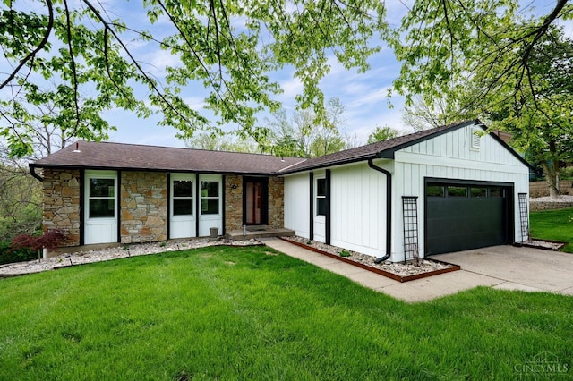 5172 Sheits Rd, Colerain Twp, OH 45251 - view of front of house featuring an attached garage, stone siding, driveway, a front lawn, and board and batten siding