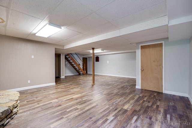 5172 Sheits Rd, Colerain Twp, OH 45251 - finished below grade area with wood finished floors, stairway, a drop ceiling, and baseboards