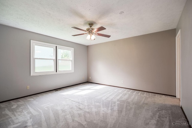 5172 Sheits Rd, Colerain Twp, OH 45251 - unfurnished room with ceiling fan, carpet flooring, a textured ceiling, and baseboards