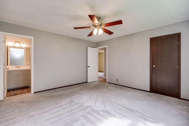 5172 Sheits Rd, Colerain Twp, OH 45251 - unfurnished bedroom with light colored carpet, a sink, baseboards, ensuite bathroom, and ceiling fan