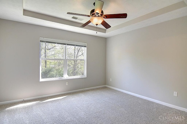 4291 Straight Arrow Rd, Beavercreek, OH 45430 - unfurnished room featuring carpet floors, ceiling fan, and a raised ceiling