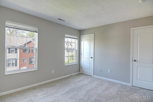 4291 Straight Arrow Rd, Beavercreek, OH 45430 - unfurnished bedroom with light colored carpet and multiple windows