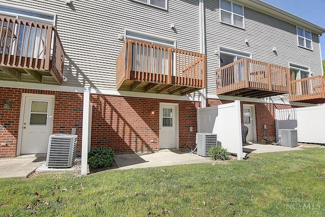 4291 Straight Arrow Rd, Beavercreek, OH 45430 - back of property with a balcony and brick siding
