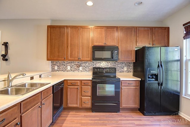 4291 Straight Arrow Rd, Beavercreek, OH 45430 - kitchen featuring black appliances, light countertops, light wood-style flooring, backsplash, and recessed lighting