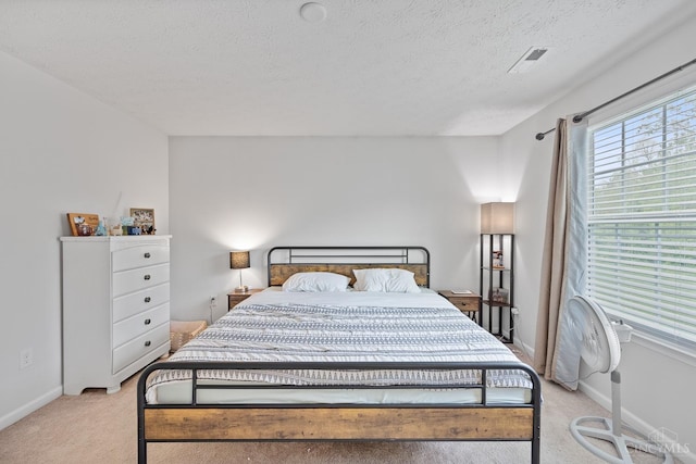 10522 Atterbury Dr, Crosby Twp, OH 45030 - bedroom with light carpet, a textured ceiling, and baseboards