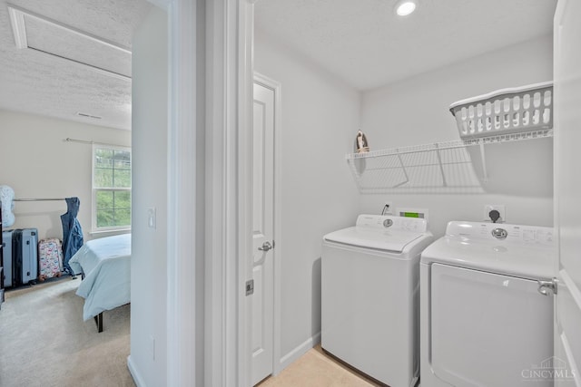 10522 Atterbury Dr, Crosby Twp, OH 45030 - laundry area with washer and dryer, a textured ceiling, light carpet, and recessed lighting