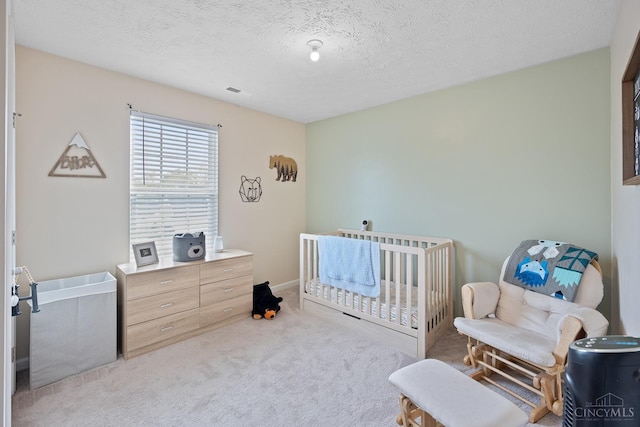 10522 Atterbury Dr, Crosby Twp, OH 45030 - bedroom featuring carpet, a textured ceiling, and a crib