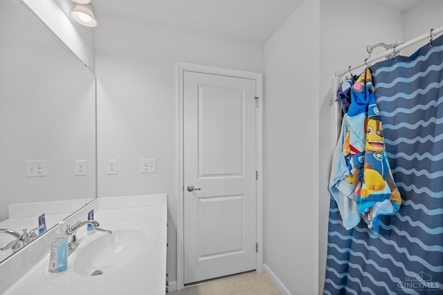 10522 Atterbury Dr, Crosby Twp, OH 45030 - bathroom with vanity, curtained shower, and baseboards