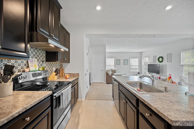 10522 Atterbury Dr, Crosby Twp, OH 45030 - kitchen featuring appliances with stainless steel finishes, a sink, open floor plan, a textured ceiling, and under cabinet range hood