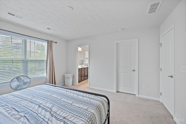 10522 Atterbury Dr, Crosby Twp, OH 45030 - bedroom featuring light carpet, a textured ceiling, baseboards, and ensuite bathroom