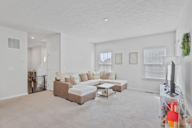 10522 Atterbury Dr, Crosby Twp, OH 45030 - carpeted living area featuring a textured ceiling and baseboards