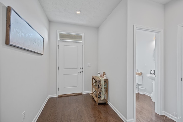 10522 Atterbury Dr, Crosby Twp, OH 45030 - hall with dark wood-style floors and baseboards