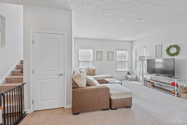 10522 Atterbury Dr, Crosby Twp, OH 45030 - carpeted living area with stairway, baseboards, and a textured ceiling