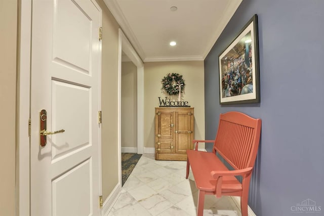 hall featuring light marble finish flooring, crown molding, baseboards, and recessed lighting