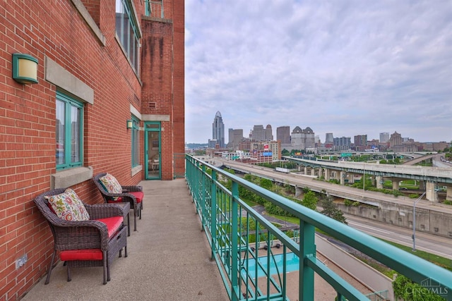 balcony featuring a skyline view